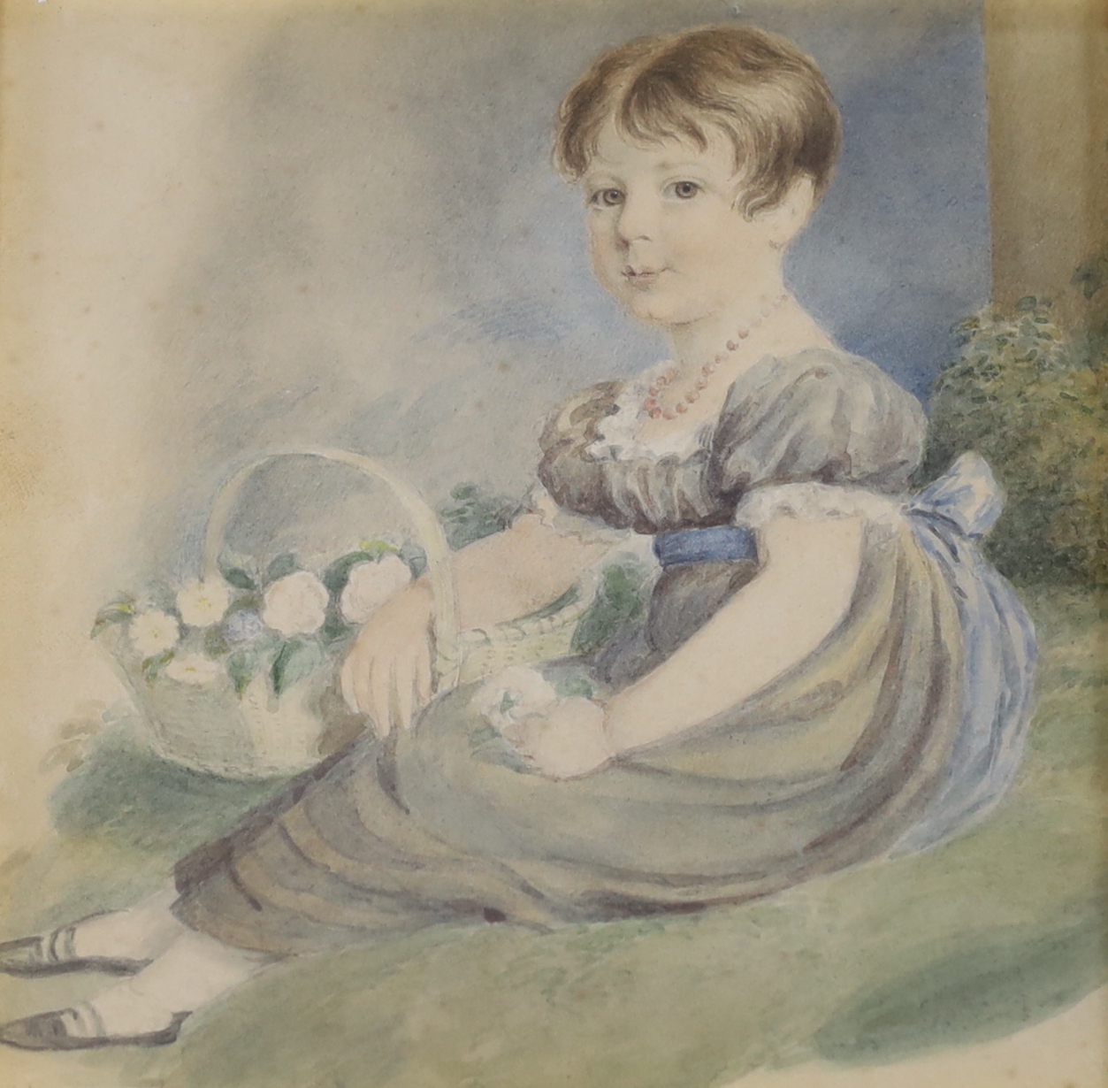 Early 19th century English School, watercolour, Seated girl holding a basket of flowers, 13cm x 13cm